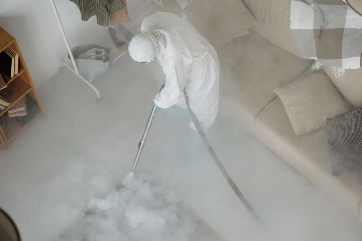 Biohazard cleanup technician in protective equipment, Columbus, MS